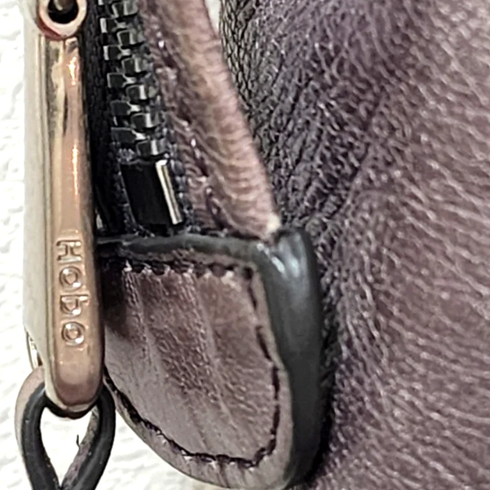 HOBO distressed leather clamshell shoulder bag with zip closure